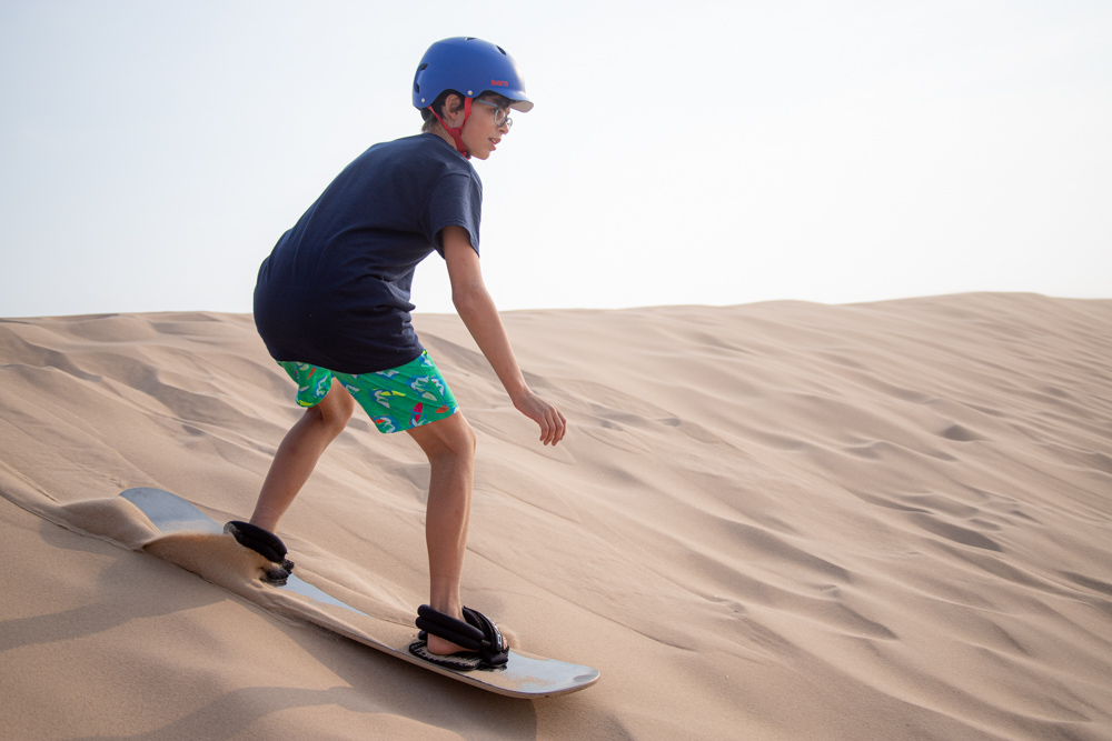 Rustic Warrior Campers riding sand boards