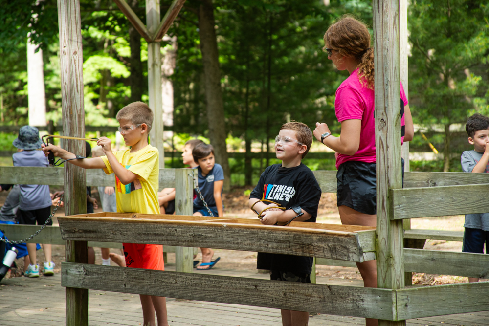 Discovery campers at the slingshot range